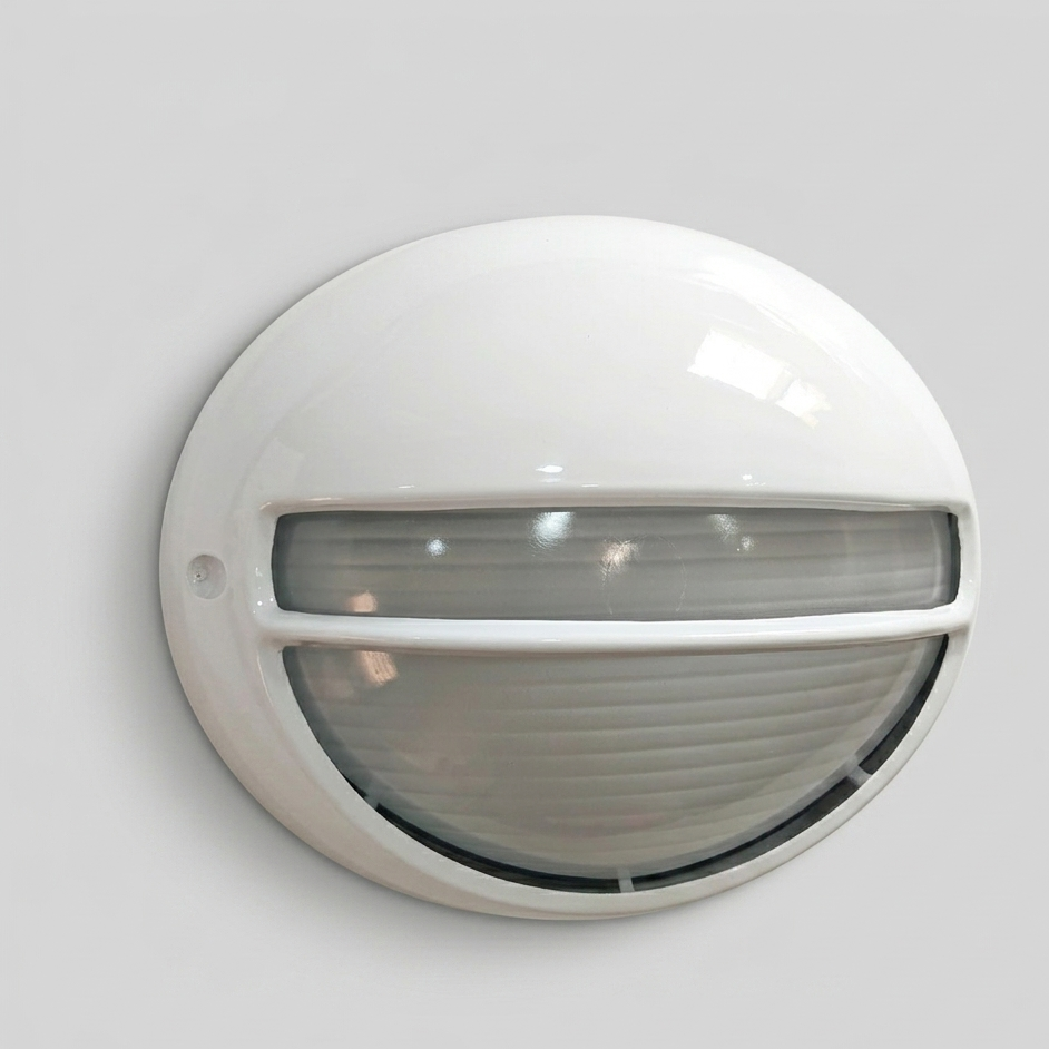 Aplique de Exterior Simon BD-9 Blanco | Diseño Ovalado con Visera y Rejilla – IP54
